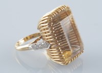 Lot 962 - A citrine dress ring, the rectangular facet...