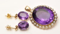 Lot 966 - An amethyst and half pearl pendant, the oval...