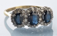 Lot 974 - A sapphire and diamond triple cluster ring,...