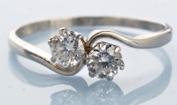 Lot 977 - A two stone diamond ring, the brilliant cut...