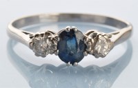 Lot 979 - A sapphire and diamond ring, the oval facet...