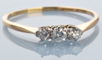 Lot 981 - A three stone diamond ring, the brilliant cut...