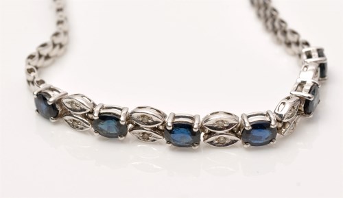 Lot 993 - A sapphire and diamond bracelet, the six...