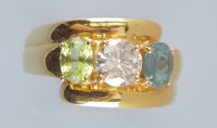 Lot 1003 - A diamond, chrysoberyl and peridot ring, the...