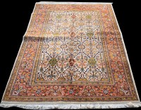 Lot 1021 - A Tabriz carpet, with floral panels on ivory...