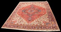 Lot 1024 - A Heriz carpet, with full geometric floral...