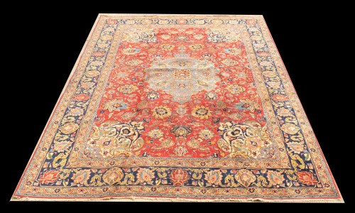 Lot 1030 - A Tabriz carpet, the blue central medallion...