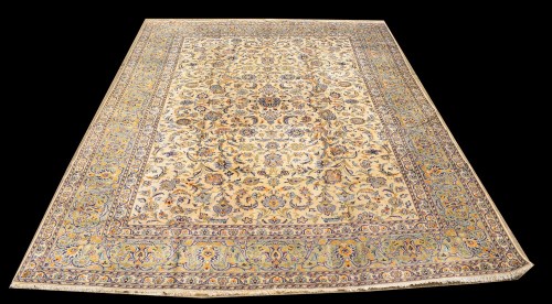 Lot 1031 - A Kashan carpet, the scrolling floral design...