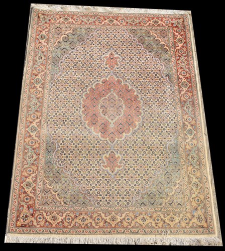 Lot 1043 - A Tabriz rug, the central rosette surrounded...