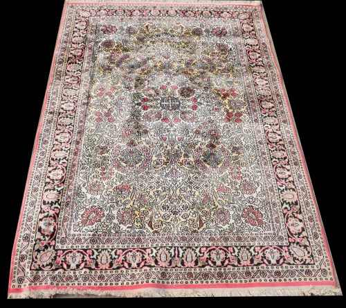 Lot 1044 - A silk rug, decorated with floral scrolls, 186...