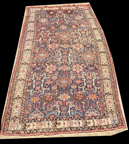 Lot 1047 - A Caucasian carpet, with bold floral design on...