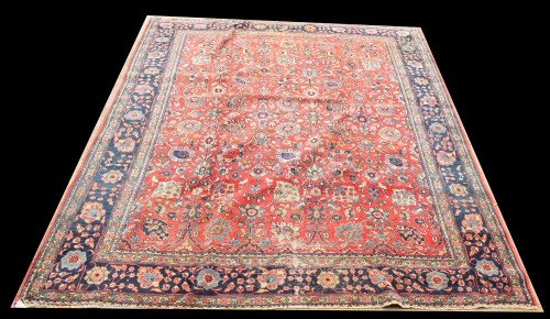 Lot 1049 - A Tabriz rug, the full floral design on red...
