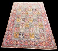 Lot 1051 - A Qum carpet, with panels of floral design,...