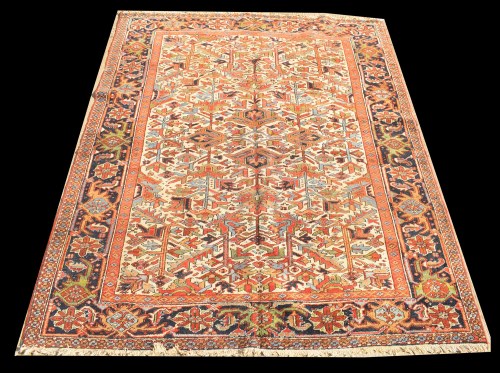 Lot 1052 - A Heriz carpet, the bold geometric floral...