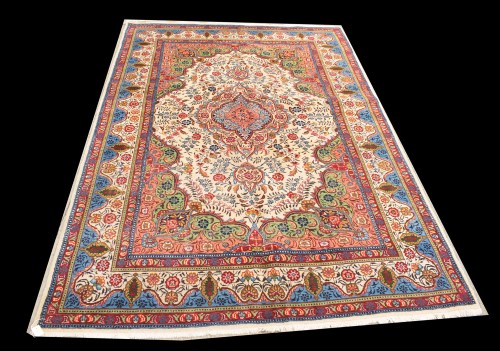 Lot 1054 - A Tabriz carpet, the blue floral central...