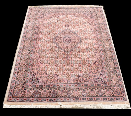 Lot 1055 - A Tabriz rug, the central diamond-shaped...