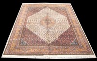 Lot 1061 - A Tabriz carpet, the diamond-shaped medallion...