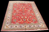 Lot 1062 - A Tabriz carpet, the bold floral scrolls on...