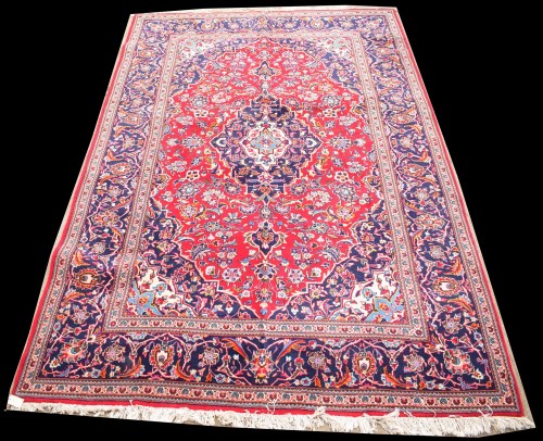 Lot 1063 - A Kashan carpet, the central diamond-shaped...