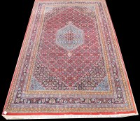 Lot 1067 - A Tabriz carpet, the diamond-shaped medallion...