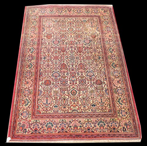 Lot 1072 - A Kashan rug, with floral design on white...