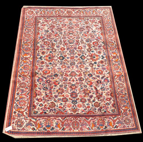 Lot 1073 - A Kashan rug, with floral design on white...