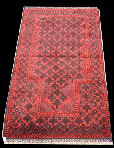 Lot 1083 - An Afghan prayer rug, in red and brown, 142 x...