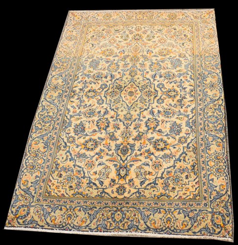 Lot 1086 - A Kashan rug, the scrolling floral design on...