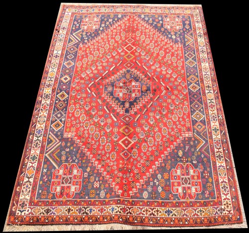 Lot 1087 - A Quashqi rug, the central diamond-shaped...