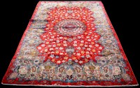 Lot 1090 - A Kashan carpet, the central rosette...