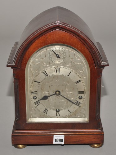 Lot 1098 - An early 20th Century mahogany mantel clock,...