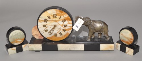 Lot 1105 - An Art Deco black slate, marble and bronze...