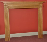 Lot 1134 - A pine fire surround, the flared mantel above...