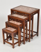 Lot 1147 - A nest of four Chinese carved wood and marble...