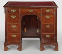 Lot 1148 - A Georgian style mahogany kneehole desk, the...