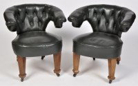Lot 1175 - A pair of early 20th Century open arm easy...