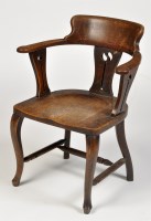 Lot 1178 - An oak Arts & Crafts captain's style chair,...