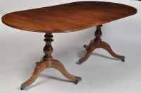 Lot 1179 - A Regency style mahogany dining table, the top...