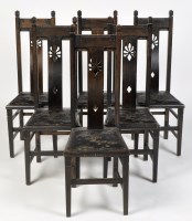 Lot 1183 - A set of six Arts & Crafts style dark stained...