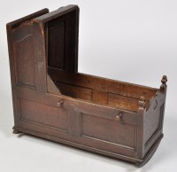 Lot 1187 - An 18th Century oak cradle, with panel sides,...