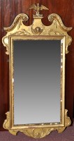 Lot 1188 - A George III giltwood and gesso wall mirror,...