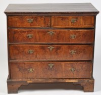 Lot 1200 - A George II walnut chest of two short and...