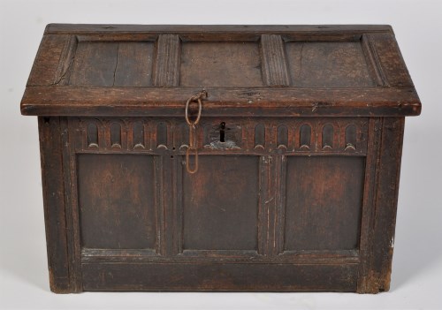 Lot 1202 - An 18th Century oak chest, with plain panel...
