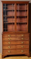 Lot 1205 - A George III mahogany secretaire bookcase, the...