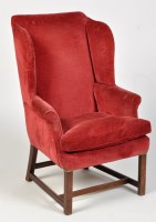 Lot 1222 - A George III wing back armchair, the back,...