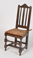 Lot 1228 - An 18th Century oak chair, the serpentine...