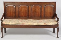 Lot 1232 - An 18th Century oak settle, the back with four...