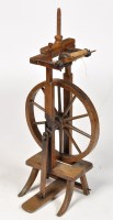 Lot 1234 - A 19th Century oak treadle spinning wheel,...