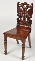 Lot 1238 - A 19th Century mahogany hall chair, the carved...