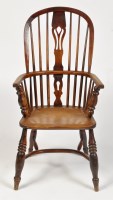 Lot 1241 - A 19th Century elm Windsor chair, the hoop...